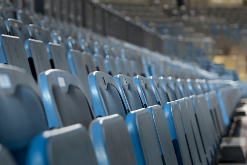 Rows of empty chairs in basketball stadium at Arena Stozice, Ljubljana, Slovenia.