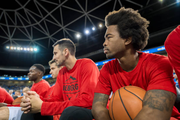 istock Basketball players watching match 1215776285