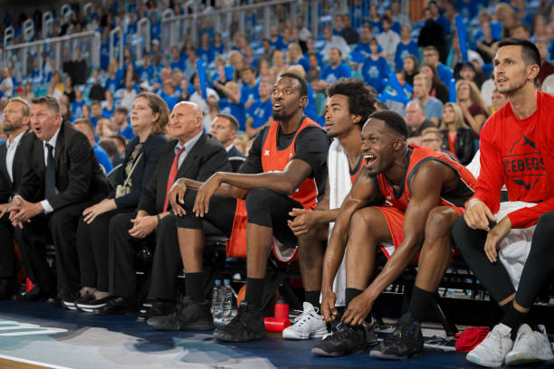 istock Basketball players watching match 1215776293