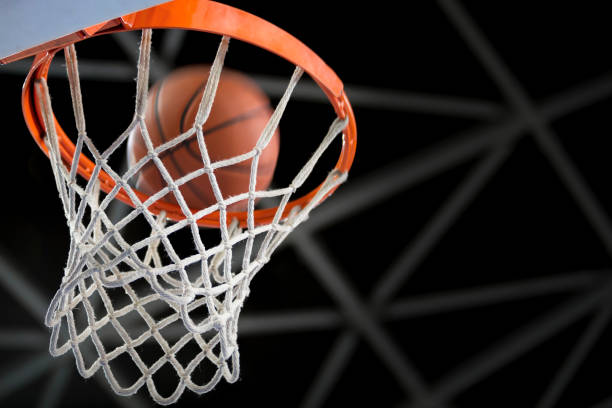 istock Basketball reaching to hoop 1215776306