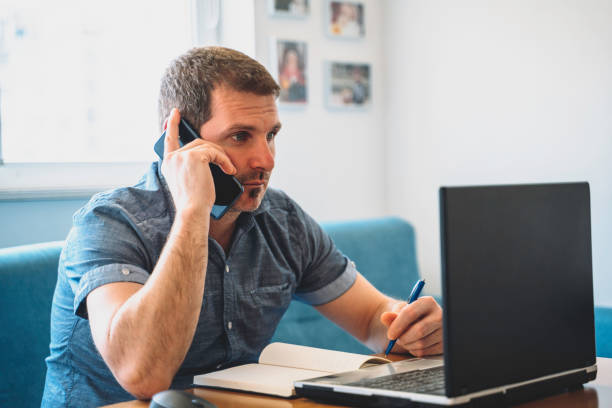 istock Businessman working on laptop from home. COVID- 19. Coronavirus epidemic. 1215779064