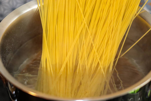 istock The exact moment when spaghetti comes into contact with boiling water. 1215779218