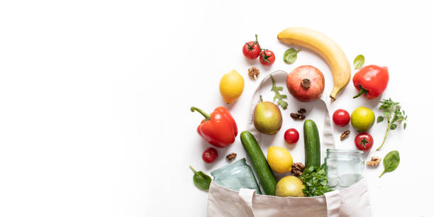 istock Concept of zero waste, environmental friendly products in a textile bag on a white background with copy space for text. 1215779731