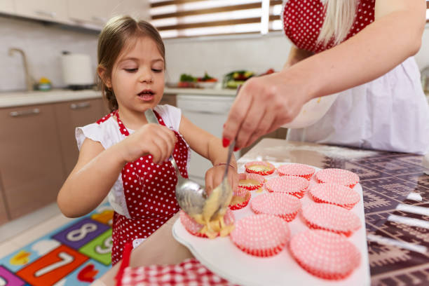 istock Mother and daughter in the kitchen 1215779812