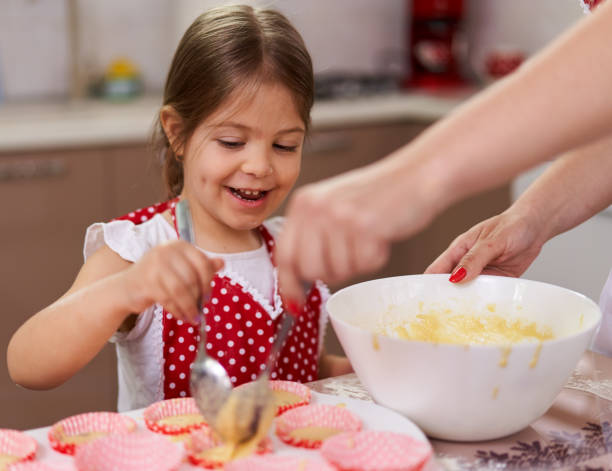 istock Mother and daughter in the kitchen 1215779813