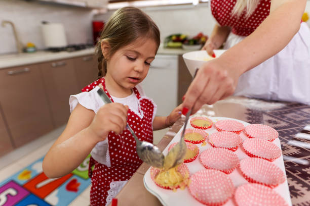 istock Mother and daughter in the kitchen 1215779816
