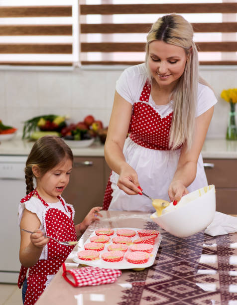 istock Mother and daughter in the kitchen 1215779817