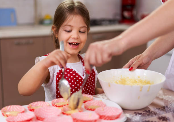 istock Mother and daughter in the kitchen 1215779820