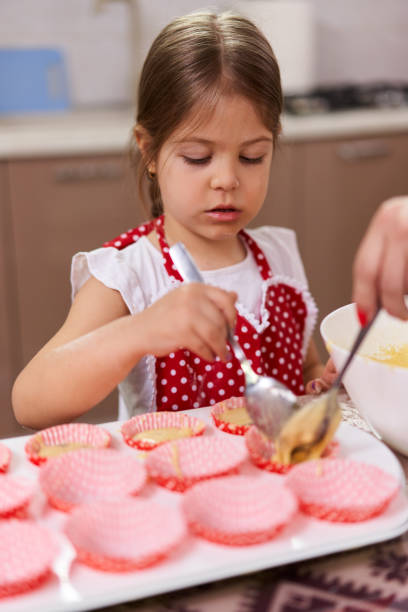 istock Mother and daughter in the kitchen 1215779828