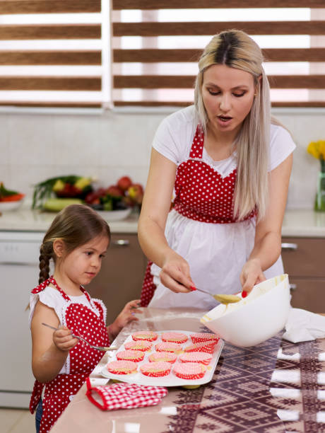 istock Mother and daughter in the kitchen 1215779831