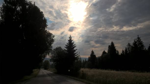 istock Sunrise or sunset over the hills and meadow. 1215780013