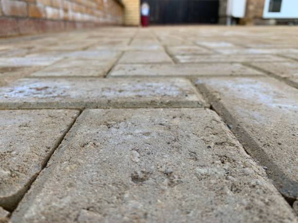 istock Close up of buff block paving driveway 1215780731