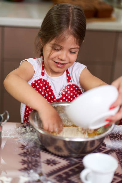 istock Mother and daughter in the kitchen 1215780858