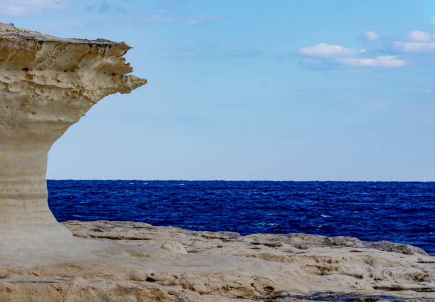 istock Blue sea clear sky and rocks 1215780878