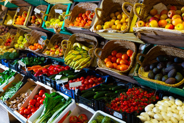 istock Raw fresh vegetables and fruits assortment on counter 1215785420