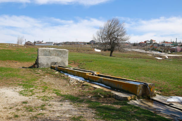 Flowing natural spring water.\nmountain water flowing trough. Turkey