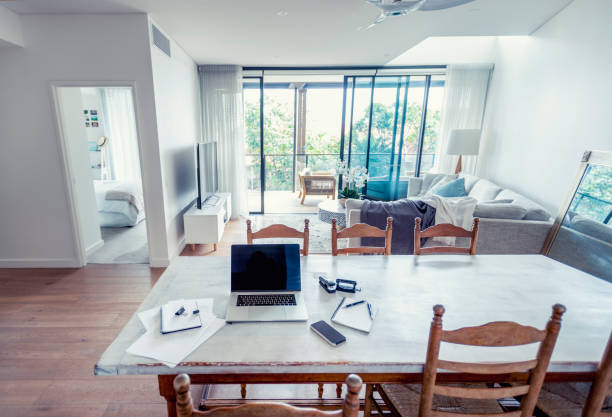 istock Impromptu home office on the dining room table. 1215786355