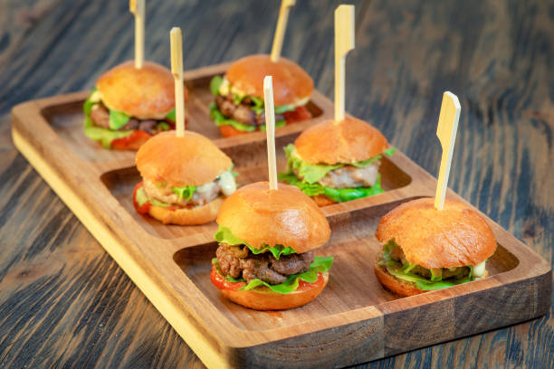 istock Appetizing hamburger with meat, cheese and herbs 1215786457