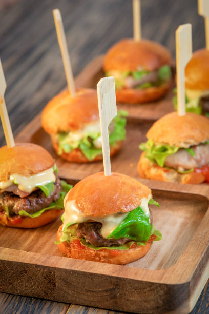 istock Appetizing hamburger with meat, cheese and herbs 1215786617