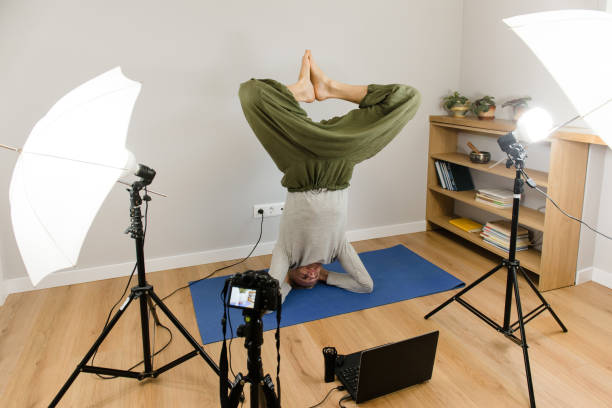 istock Online yoga practice, webinar e-learning, teacher working at home 1215787959