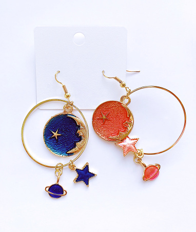 beautiful earrings-planets and stars. Space style. mobile photo