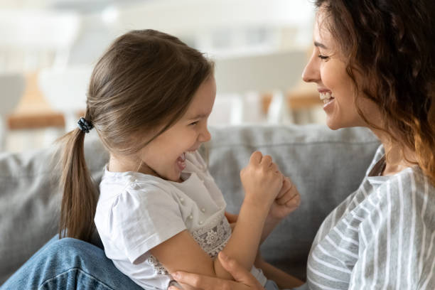 istock Young mum and little daughter have fun playing 1215789557