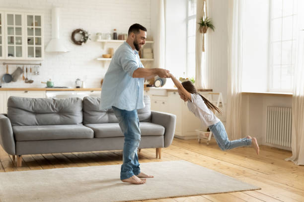 istock Young have fun playing with cute little daughter 1215789561