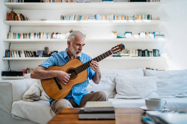 istock Senior man playing guitar 1215790999