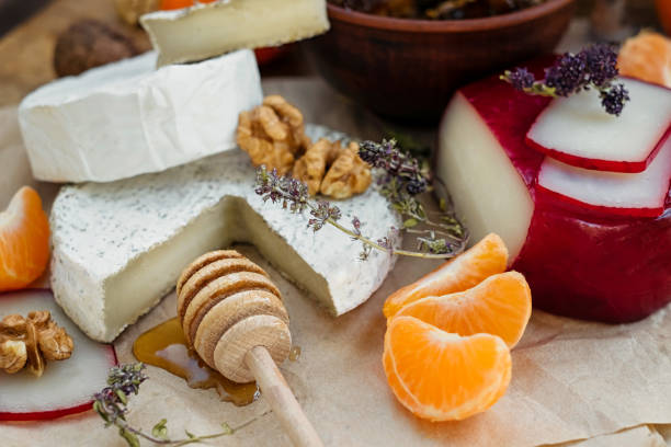 istock camembert, brie, gouda cheese served on the table 1215791158