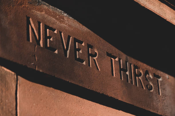 istock Carving of a message on a public fountain 1215791167