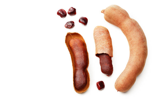 istock fresh tamarind fruits isolated on white background. top view 1215793230