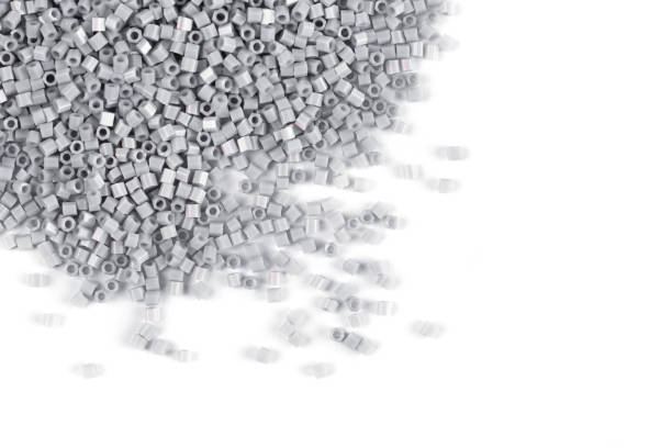 istock A scattering of gray matte beads on a white background 1215795599