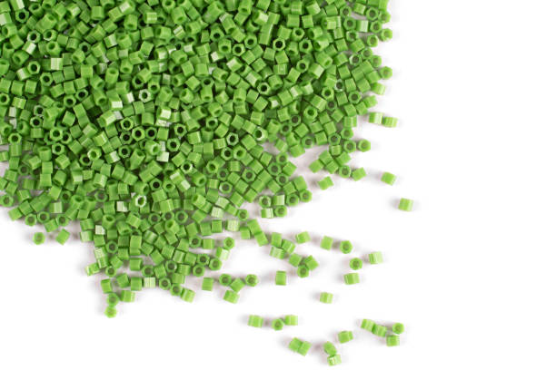 istock A scattering of green matte beads on a white background 1215796811