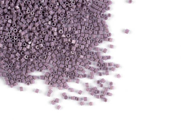 istock A scattering of pink -powdered matte beads on a white background 1215797233