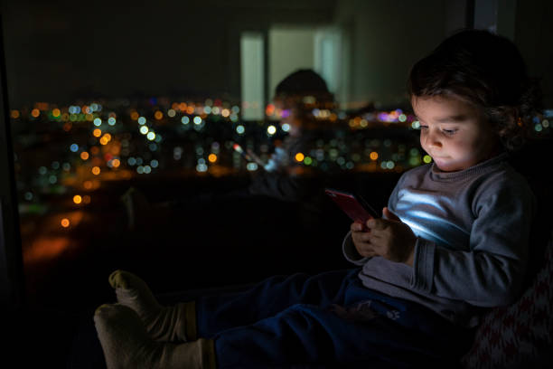 istock Boy by phone at home 1215797513