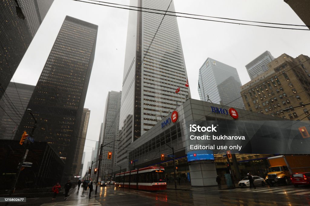 BMO Bank in the Financial District of Toronto February 26, 2020 - Toronto, Ontario, Canada:Financial District of Toronto on Bay Street, skyscrapers, BMO Bank building and Toronto Transit Commission street car. BMO bank in downtown Toronto on Bay Street on a snowy day in February 2020. Finance and banking industry in Canada. Canadian bank. Canadian economy Toronto Stock Photo