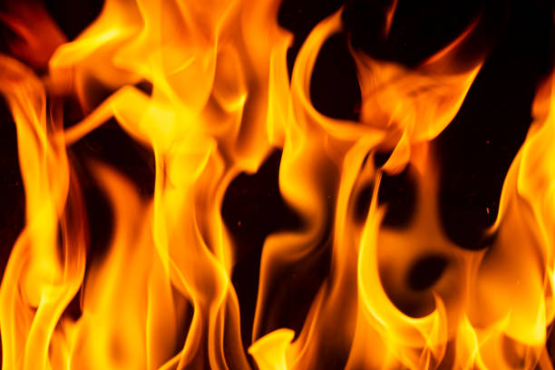 Close up on flames burning in the fireplace during a cold winter night