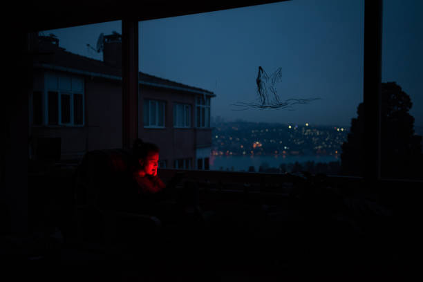 Night scene of moon seen through the window from dark room. Moonlight inside dark room