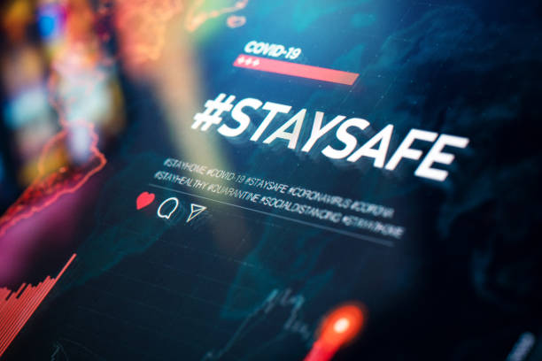 istock #staysafe. Stay safe hashtag close-up on digital display 1215804807