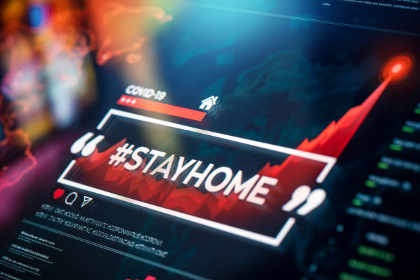 istock #stayhome. Stay home hashtag close-up on digital display 1215804930