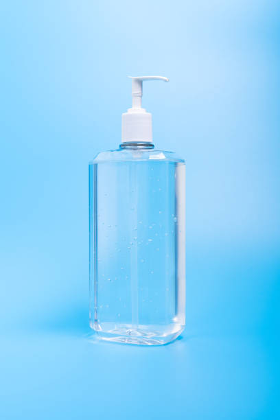 istock Hand sanitizer in plastic bottle on blue background 1215805069