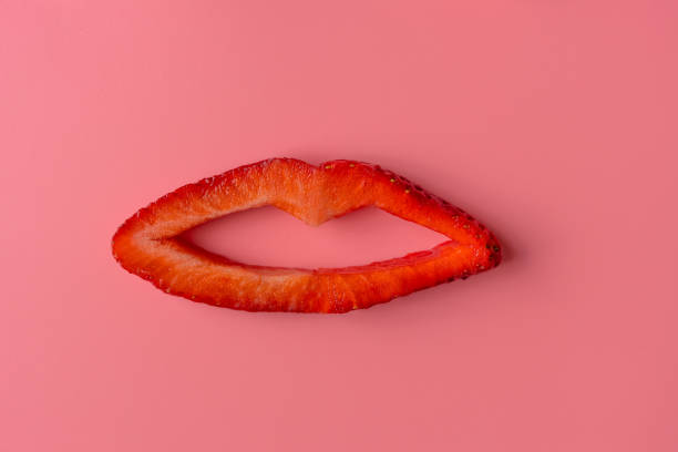 Contemporary art. Concept strawberry lips on pink background. Food art Contemporary art. Concept strawberry lips on pink background. Food art crazy makeup stock pictures, royalty-free photos & images