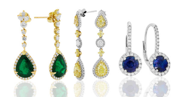 earrings and jewelry with diamonds and gemstones emeralds ruby and sapphire earrings and jewelry with diamonds and gemstones emeralds ruby and sapphire diamond earring stock pictures, royalty-free photos & images