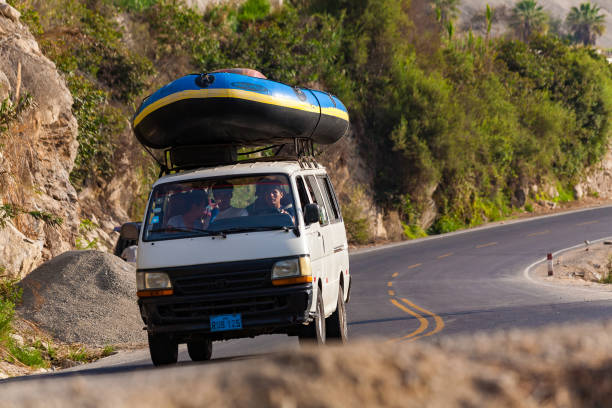 rafting boat on a transport vehicle, lunahuana, lima, peru. - sports team sport rowing teamwork rafting imagens e fotografias de stock