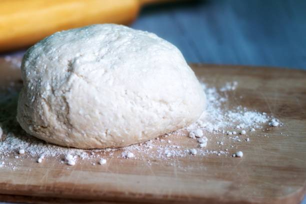 istock raw dough for cookies ready for baking. food pattern, home cooking concept 1215811890