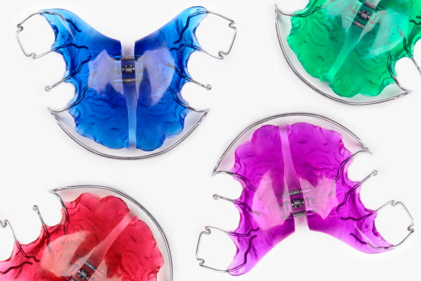 Close-up of children's orthodontic appliances in bright, fun colours stock photo