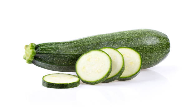 istock fresh zucchini with slice isolated on white background 1215812895