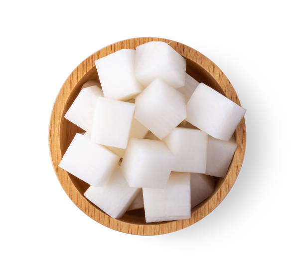 istock Sliced radish in wood bowl on white background 1215812905