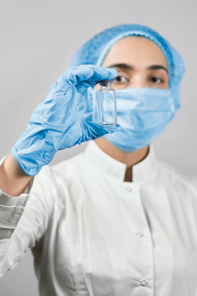 istock Scientist virologist hold coronavirus vaccine 1215817972