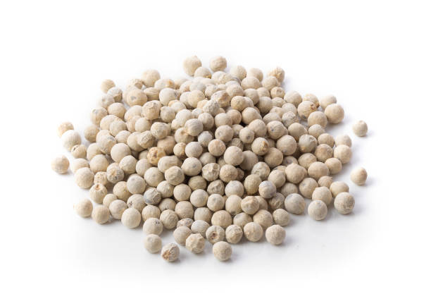 istock white peppercorn on white background. full depth of field 1215818229
